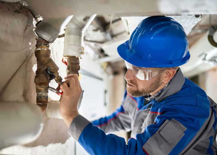 a water damage expert doing a water pipe repair in Edgewater, FL